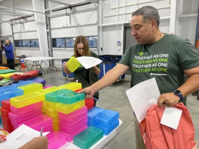 Volunteers stuff the bus
